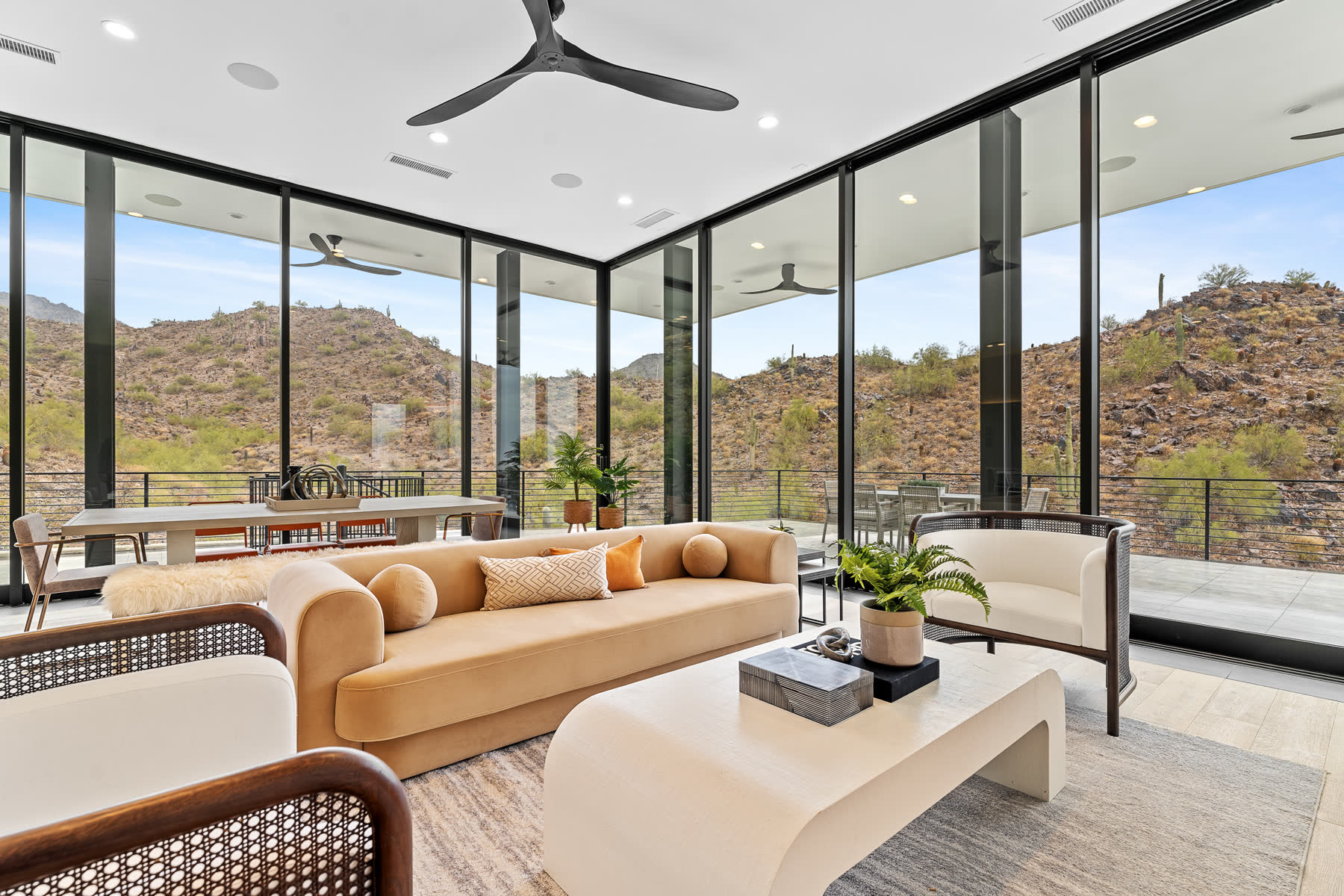 Living room with floor-to-ceiling glass, shot to a team standard