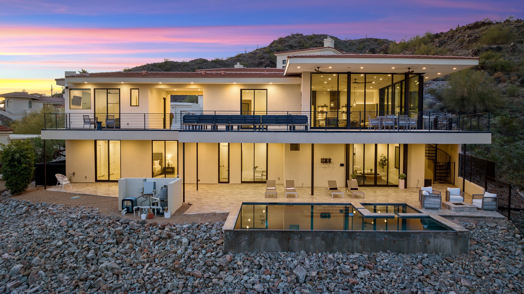 Modern glass home at twilight